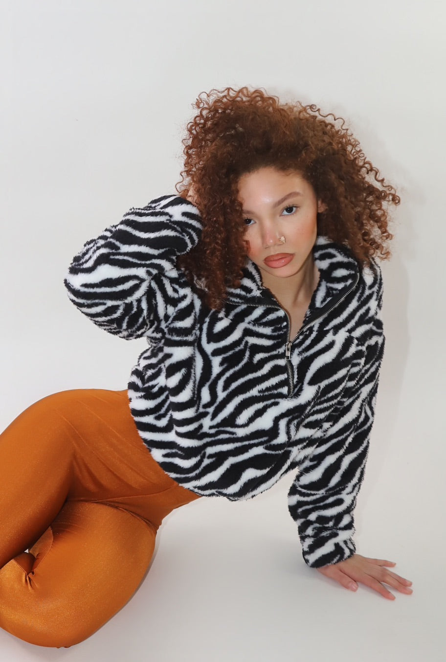 zebra print Sherpa, fuzzy half-zip pullover, animal print Sherpa jacket, cozy winter pullover, plush fleece jacket, oversized fuzzy sweater, trendy animal print outerwear, warm Sherpa pullover, street-style fleece, soft zip-up hoodie