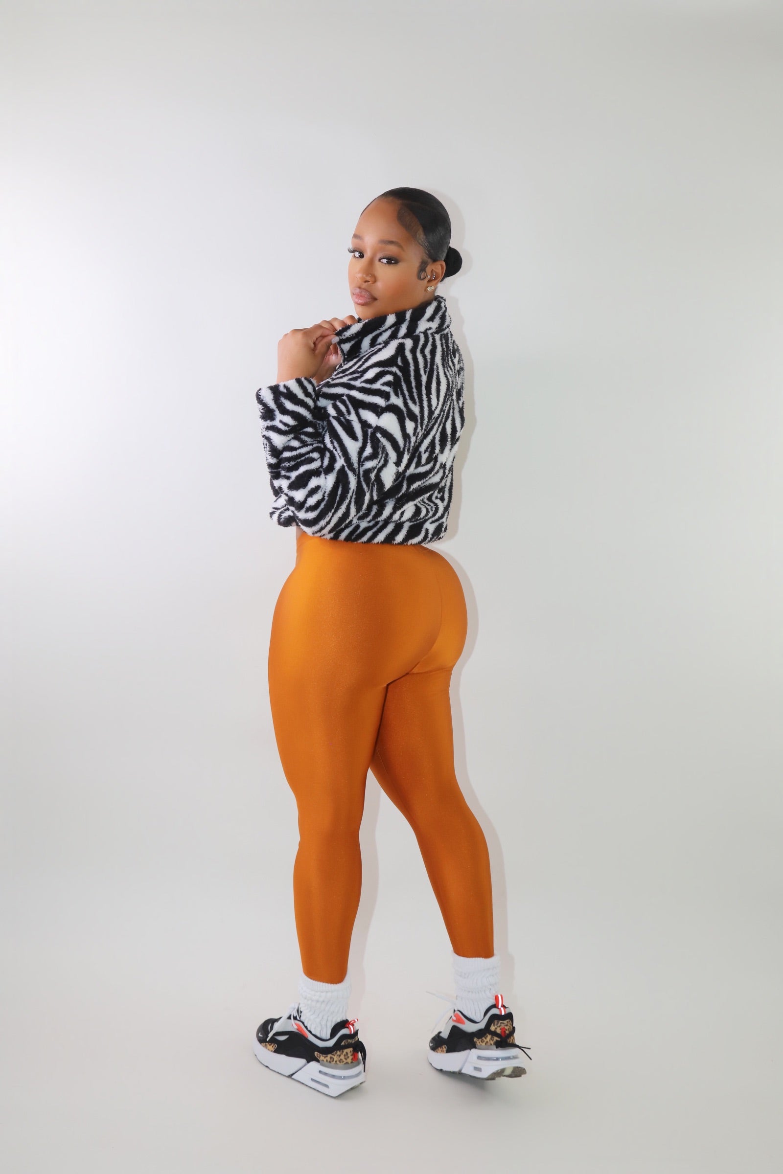 animal print Sherpa jacket, cozy winter pullover, plush fleece jacket, oversized fuzzy sweater, trendy animal print outerwear, warm Sherpa pullover, street-style fleece, soft zip-up hoodie